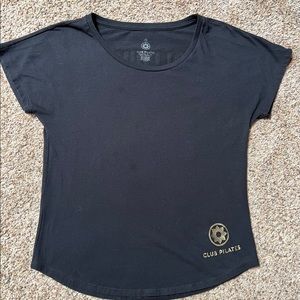 Follow me to Pilates. Size small. ***Slight discoloring on front.  Club Pilates.